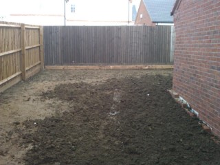 Adding_top_soil_levelling_the_garden