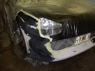 Car_being_fixed_masked_front_left