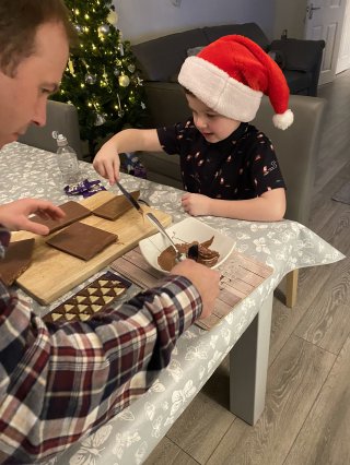 Ethan_and_i_chocolate_house_building_dec_2021