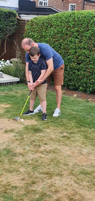 Ethan_and_i_golf_practice_howard_and_rosies_july_2022