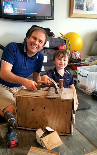 Ethan_and_i_hammering_recycled_wood_plant_box_aug_2020