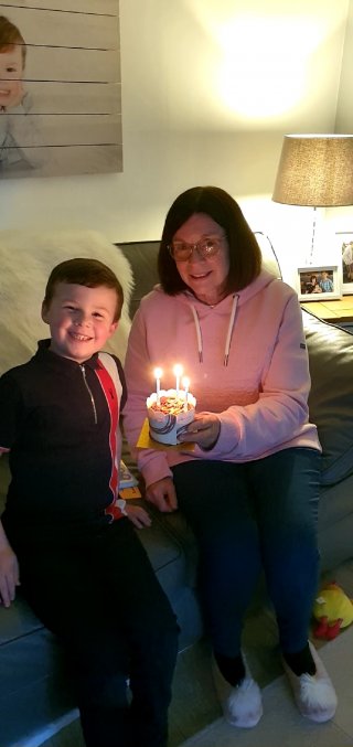 Ethan_blowing_out_cake_joys_birthday_may_2023