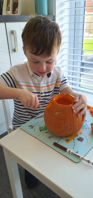 Ethan Carving Pumpkin Busy Day Oct 2020