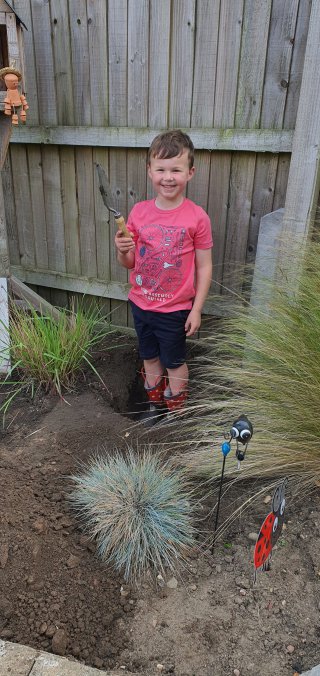 Ethan Digging Garden Pots July 2021