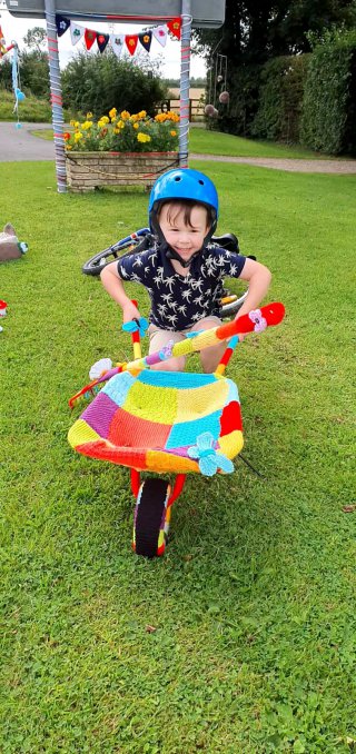 Ethan_knitted_wheelbarrow_combine_harvester_bike_ride_aug_2020