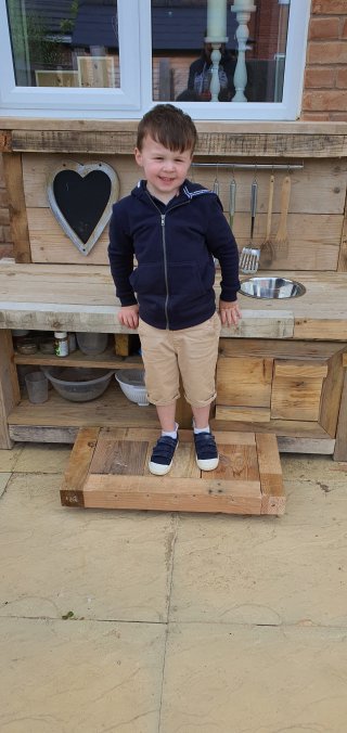 Ethan On The Finished Mud Kitchen Step June 2020