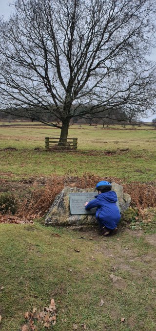 Ethan_reading_riding_bike_bradgate_park_jan_2020