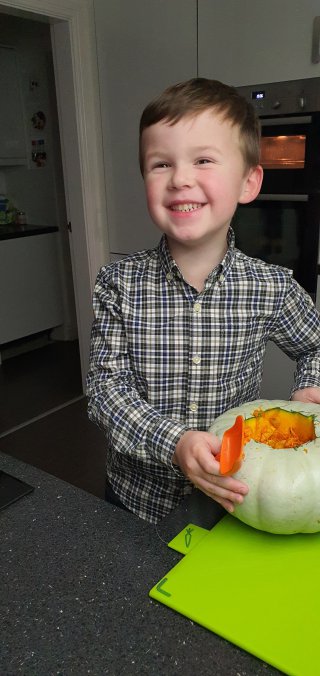 Ethan Scooping Blue Pumpkin Carving Oct 2021