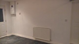 Glossing_the_garage_nov_2016_skirting_radiator_wall