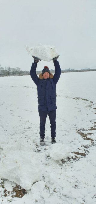 Me_pressing_snowball_full_snow_day_jan_2021