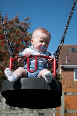 Sapcote_park_august_2016_ethan_on_the_swing