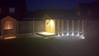 Seat_shed_and_circle_garden_lights_in_the_night_june_2017