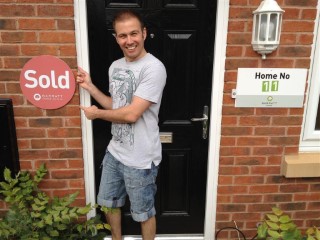 Sold_sign_on_new_townhouse_me