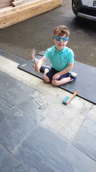 ethan_fixing_broken_garage_floor_tile_june_2020